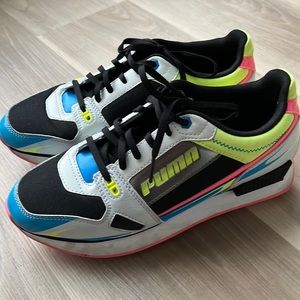 Size 10 multi color pumas . Worn twice .